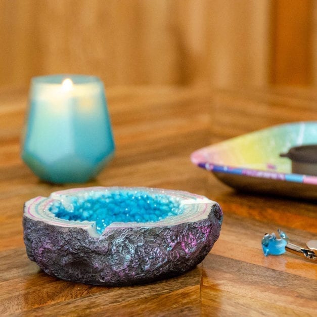 Side photo of sparkling blue geode ashtray.