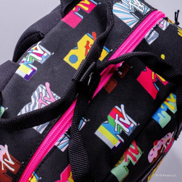 Top handle of the Loungefly MTV Logo Full Sized Nylon Backpack.