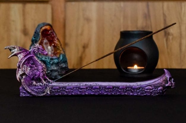 Side photo of the Purple Dragon Incense burner with skull accents.