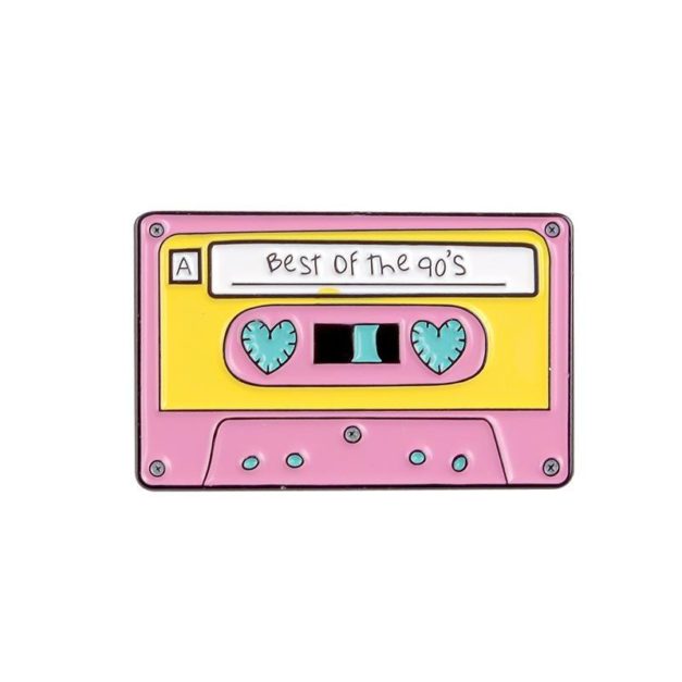 Enamel Pin shaped like a cassette tape that has "Best of the 90s" written on the label.