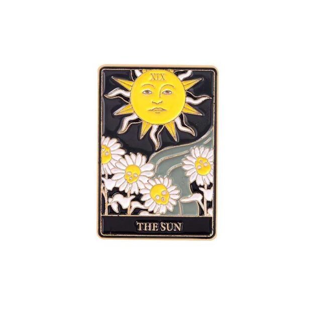 The Sun tarot card enamel pin close-up photo.